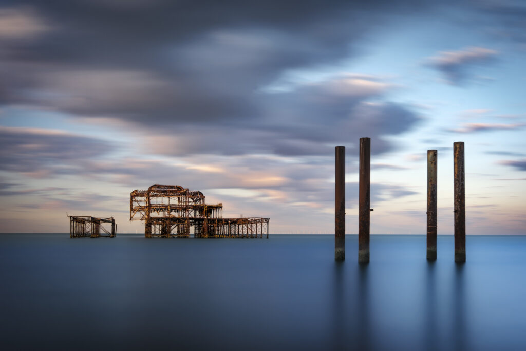Surreal seascape of Brighton West Pier at dawn