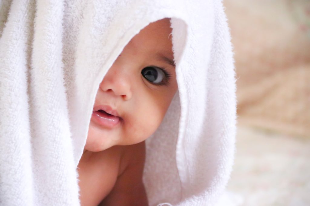 baby under the towel